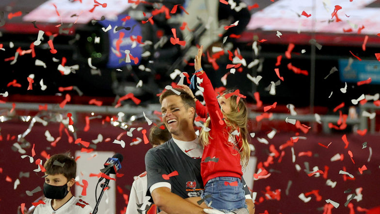 Tampa, United States. 08th Feb, 2021. Super Bowl MVP Tom Brady holds  daughter Vivian Brady who reaches for falling confetti during the Vince  Lombardi Trophy Presentation after Super Bowl LV at Raymond