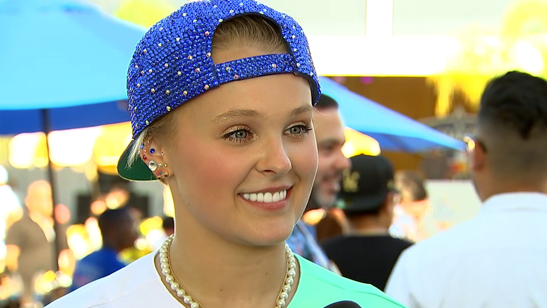 JoJo Siwa Jokes She Needs To 'Stop Swinging Like A Straight Girl' For